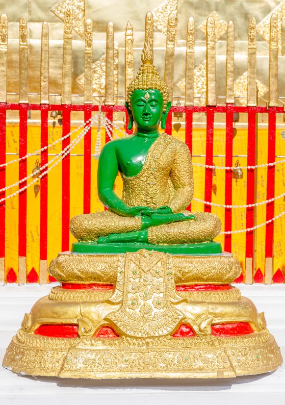 Green buddha on temple in Thailand