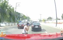 สาวคุยโทรศัพท์ข้ามถนนช่วงรถติดไฟแดงถูกรถชน