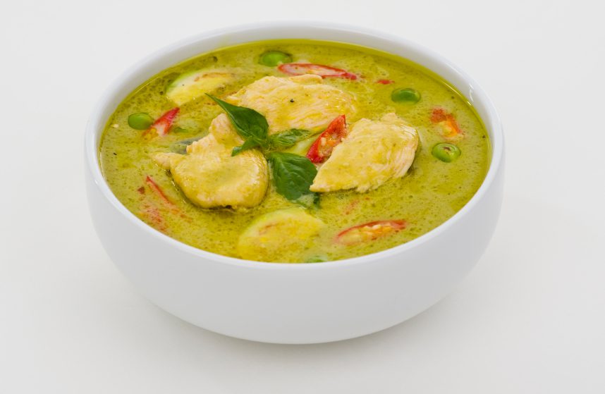 green curry in a white bowl