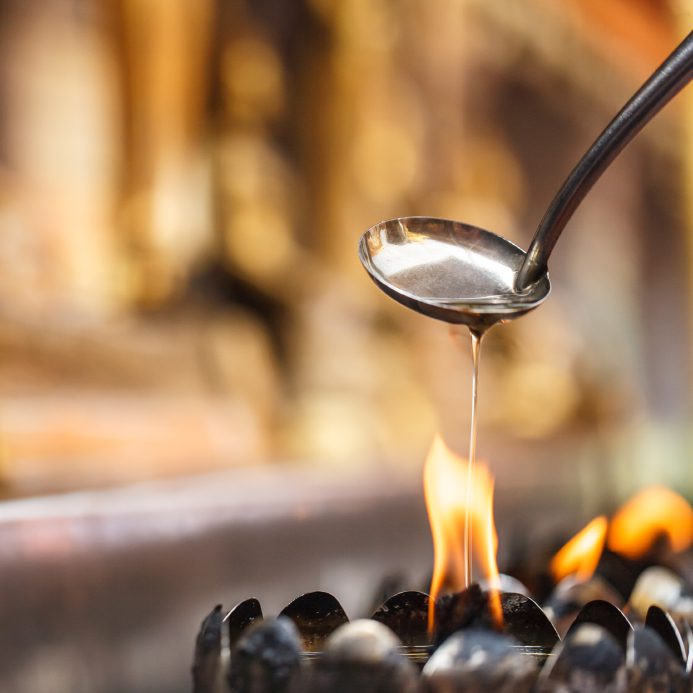 Oil filling in Thai style metal candle