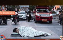 สั่งปรับ 100 บ.นักศึกษานอนถ่ายภาพกลางสี่แยกไฟแดง