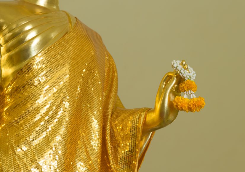 Buddha statue hold garland